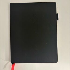 Sleek Black Notebook with Vibrant Red Accent
